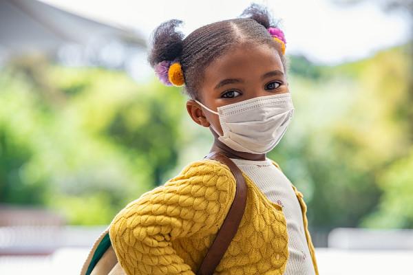 a girl wearing a pandemic mask