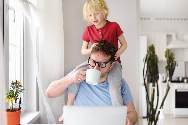 a boy on his father's shoulders