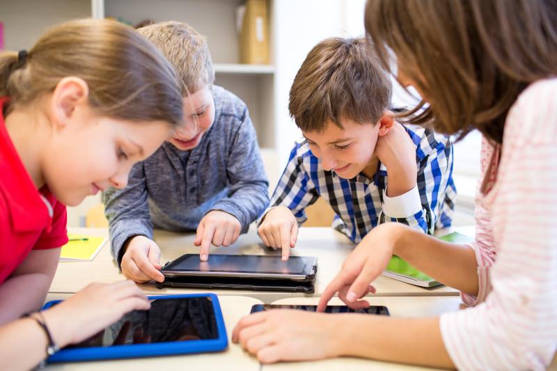 children playing on tablets