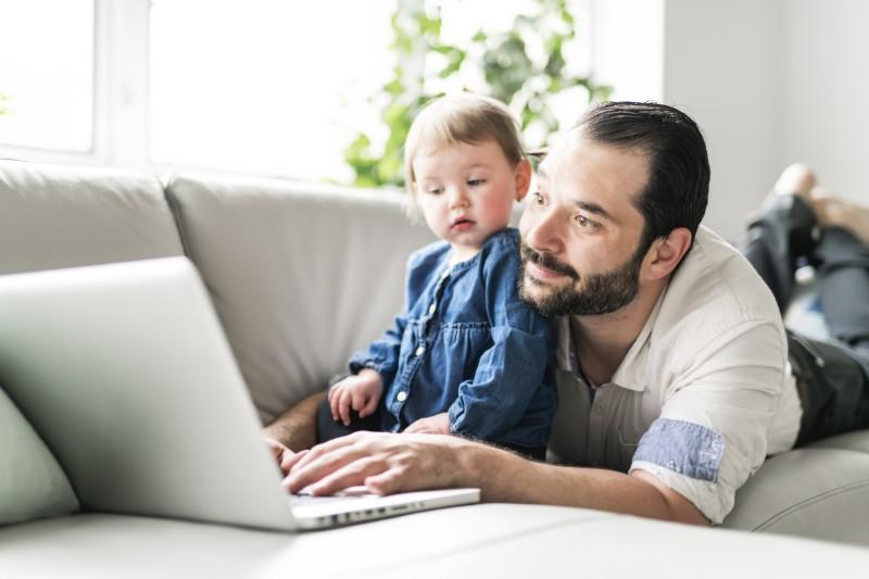 a son and father on a laptop together