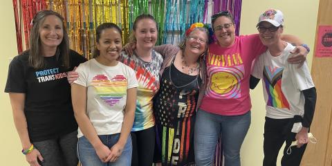 a group of people in rainbow colors